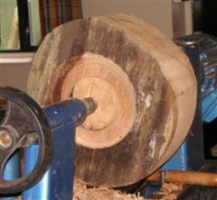 Dave starts off a large walnut log by forming the spigot